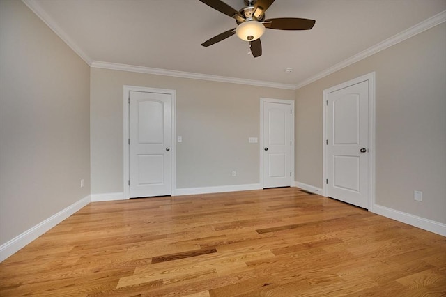 unfurnished bedroom with crown molding, light wood-type flooring, baseboards, and a ceiling fan