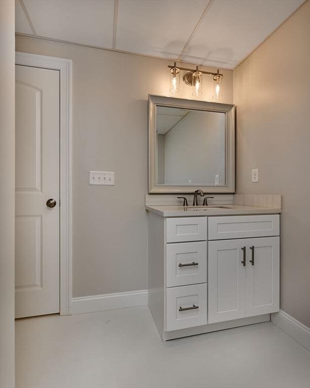 bathroom with vanity and baseboards