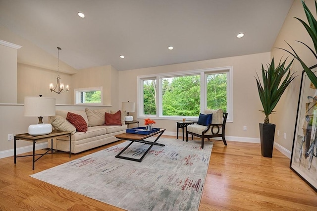 living area featuring vaulted ceiling, baseboards, a chandelier, light wood-style flooring, and recessed lighting