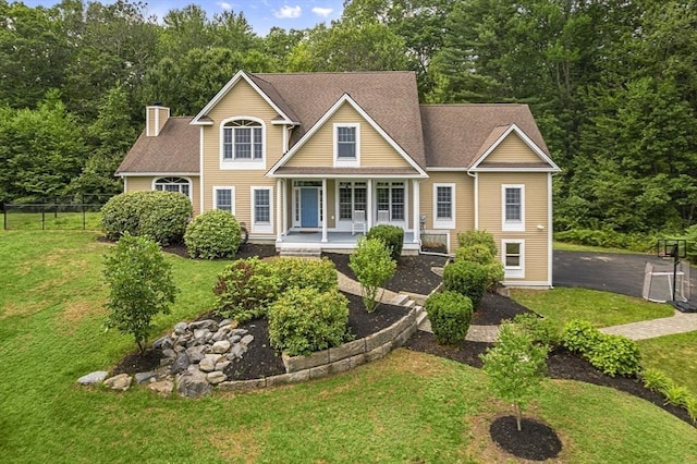 455 Brockelman Rd, Lancaster, MA 01523 - traditional home featuring a porch and a chimney