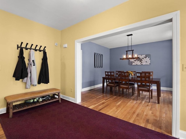 455 Brockelman Rd, Lancaster, MA 01523 - dining room featuring wood finished floors and a chandelier