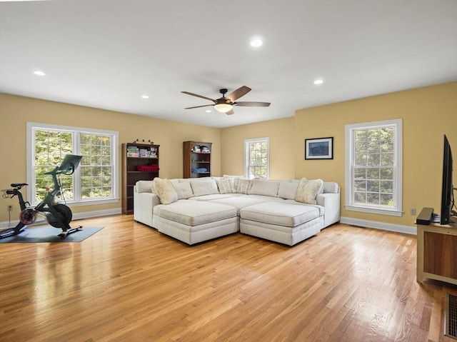 455 Brockelman Rd, Lancaster, MA 01523 - living room with light wood finished floors, ceiling fan, and recessed lighting