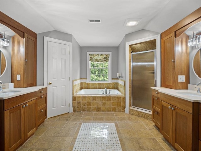 455 Brockelman Rd, Lancaster, MA 01523 - full bath with two vanities, lofted ceiling, a shower stall, and a bath
