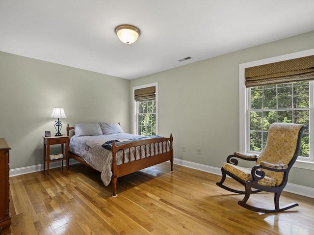 455 Brockelman Rd, Lancaster, MA 01523 - bedroom featuring light wood-style flooring and multiple windows