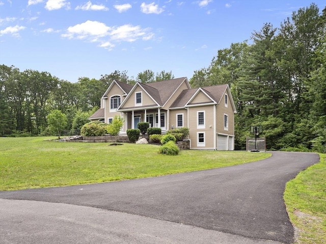 455 Brockelman Rd, Lancaster, MA 01523 - craftsman house with a garage, covered porch, a front yard, and driveway