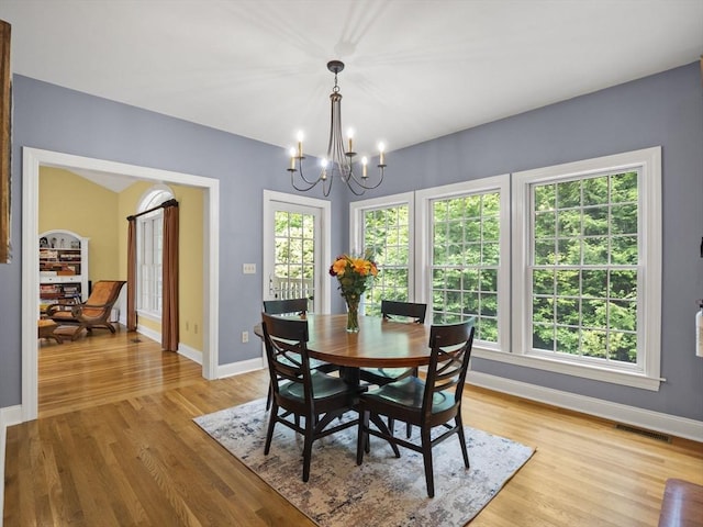 455 Brockelman Rd, Lancaster, MA 01523 - dining space featuring a chandelier, light wood-type flooring, and healthy amount of natural light