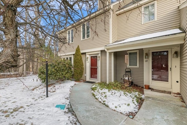 view of snow covered property entrance