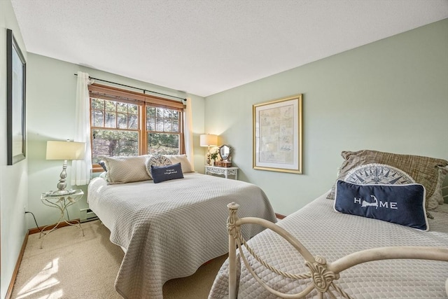 carpeted bedroom featuring a textured ceiling, baseboard heating, and baseboards