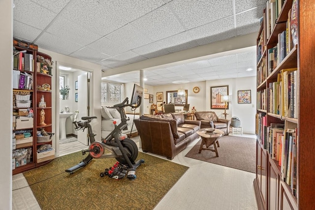 workout area with a drop ceiling