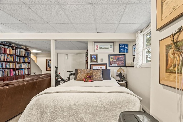 bedroom featuring a drop ceiling