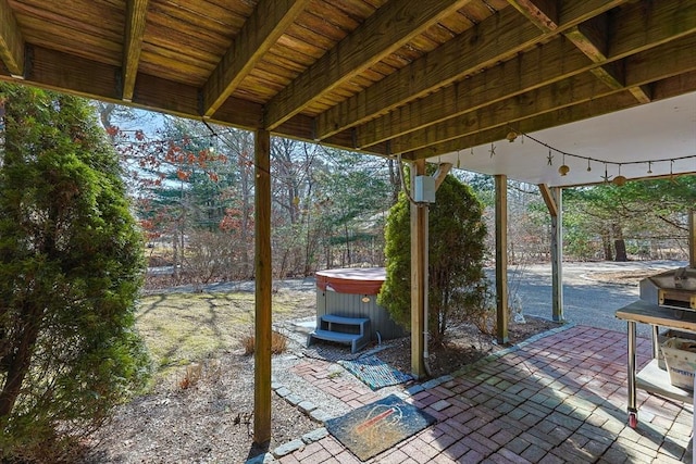 view of patio / terrace with a hot tub