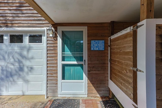 doorway to property featuring a garage