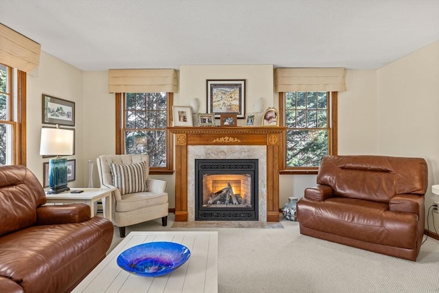 living room featuring carpet and a fireplace