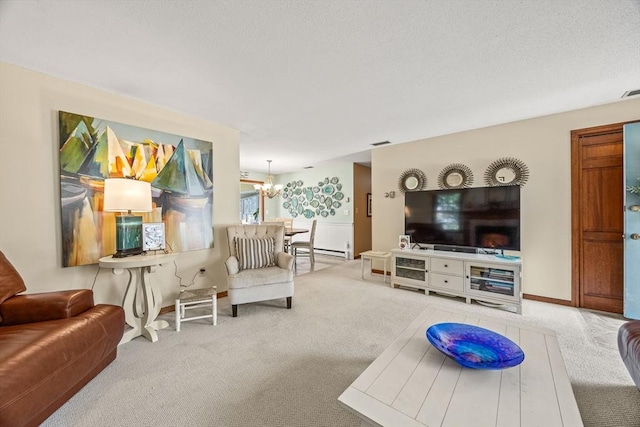 living area featuring visible vents, baseboard heating, an inviting chandelier, carpet flooring, and a textured ceiling