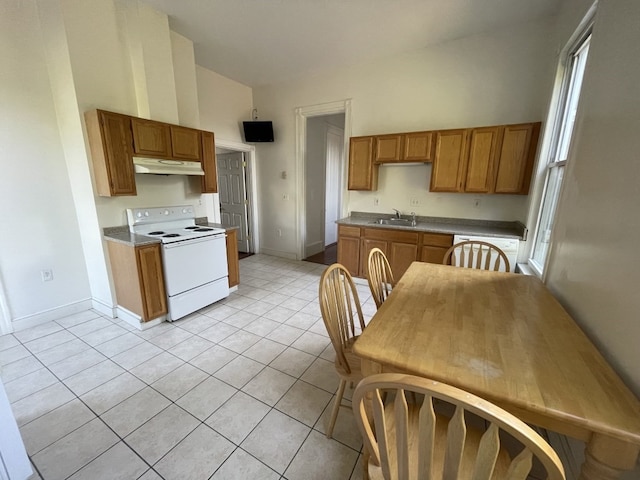 kitchen featuring light tile patterned flooring, electric stove, high vaulted ceiling, sink, and plenty of natural light