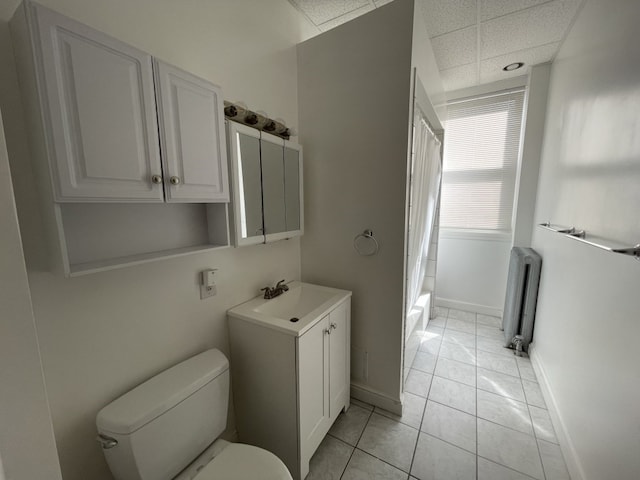 full bathroom featuring shower / bathtub combination with curtain, radiator, tile patterned floors, vanity, and toilet