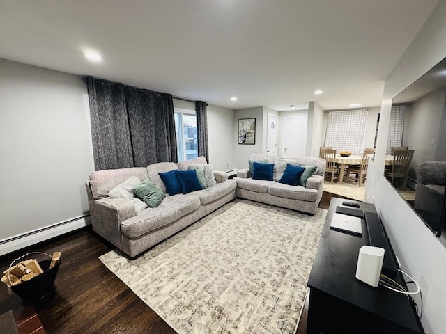 living area featuring wood finished floors, recessed lighting, a baseboard radiator, and baseboards