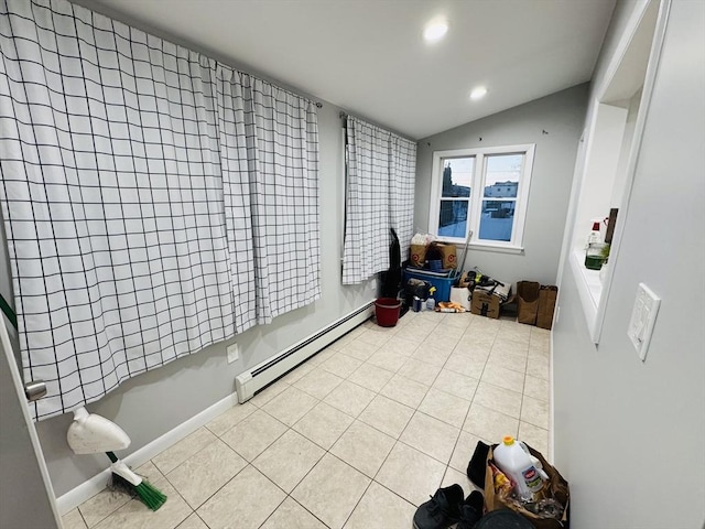 sunroom / solarium featuring baseboard heating and lofted ceiling