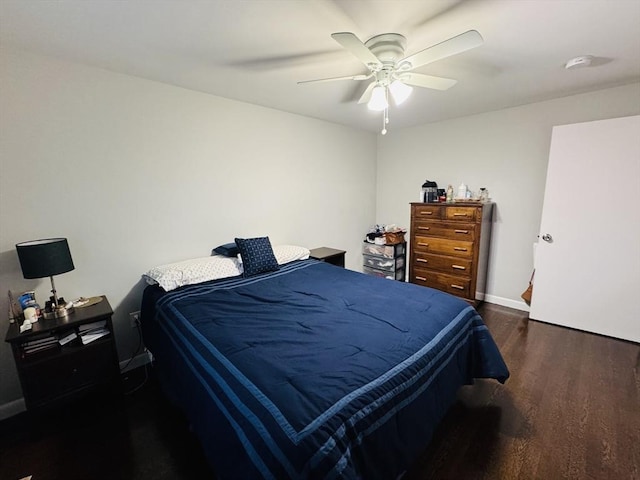 bedroom with wood finished floors, baseboards, and ceiling fan
