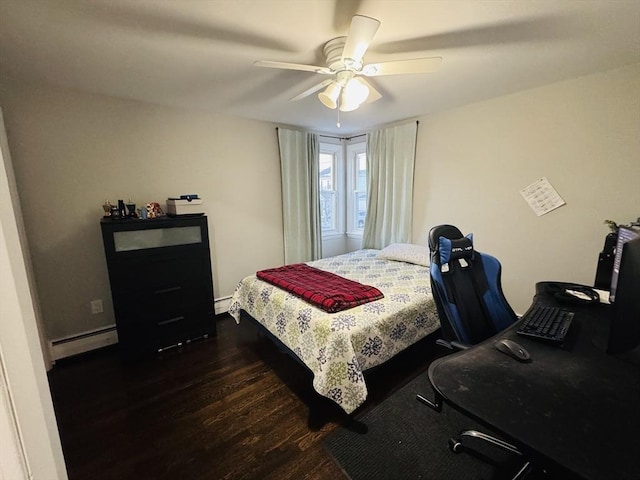 bedroom featuring dark wood-type flooring, a baseboard heating unit, and a ceiling fan