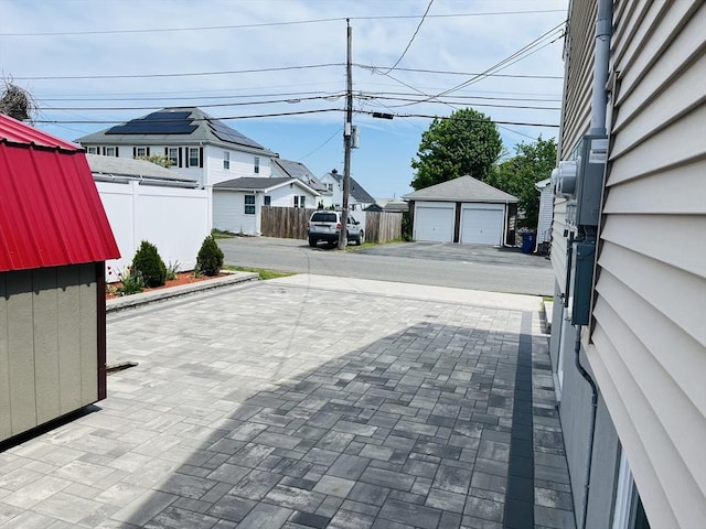 view of decorative driveway with a residential view