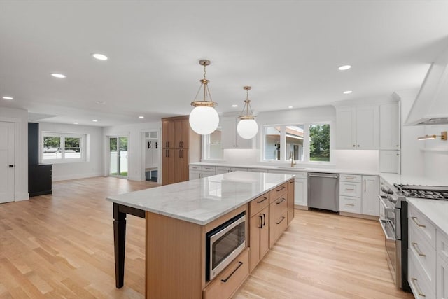 14 Norman Ave, Newburyport, MA 01950 - kitchen with appliances with stainless steel finishes, healthy amount of natural light, recessed lighting, light wood-style floors, and open floor plan
