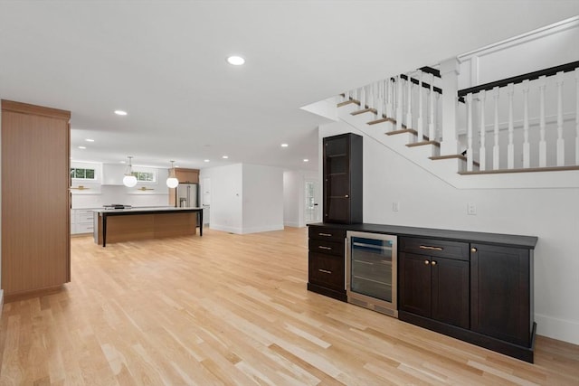 14 Norman Ave, Newburyport, MA 01950 - bar with wine cooler, stainless steel fridge with ice dispenser, light wood-style floors, recessed lighting, and decorative light fixtures