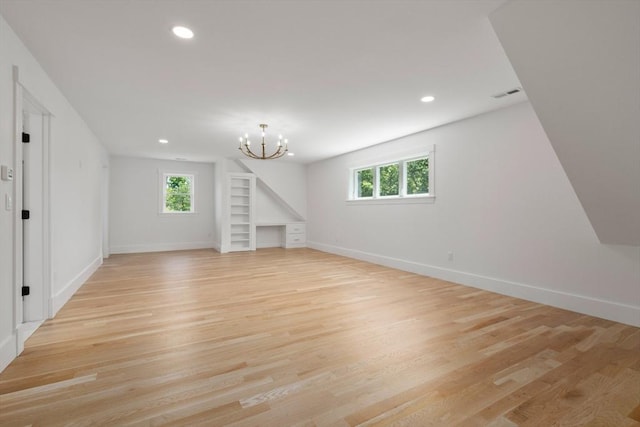 14 Norman Ave, Newburyport, MA 01950 - unfurnished living room featuring recessed lighting, light wood-style flooring, and a chandelier