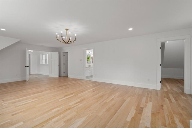 14 Norman Ave, Newburyport, MA 01950 - unfurnished living room featuring a chandelier, light wood-style flooring, and recessed lighting