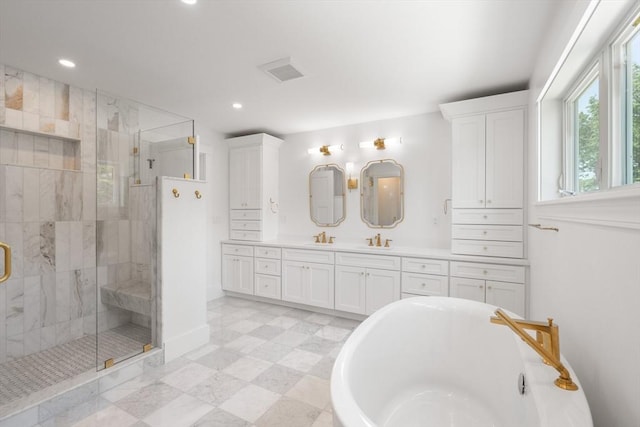14 Norman Ave, Newburyport, MA 01950 - bathroom featuring a soaking tub, double vanity, a stall shower, and recessed lighting