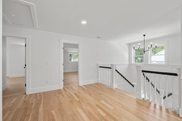 14 Norman Ave, Newburyport, MA 01950 - empty room with light wood-style floors, a chandelier, attic access, and recessed lighting