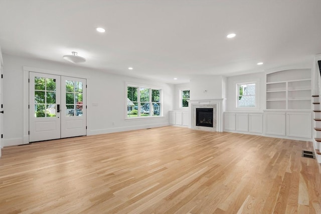 14 Norman Ave, Newburyport, MA 01950 - unfurnished living room featuring recessed lighting, light wood-style flooring, a fireplace, and built in features