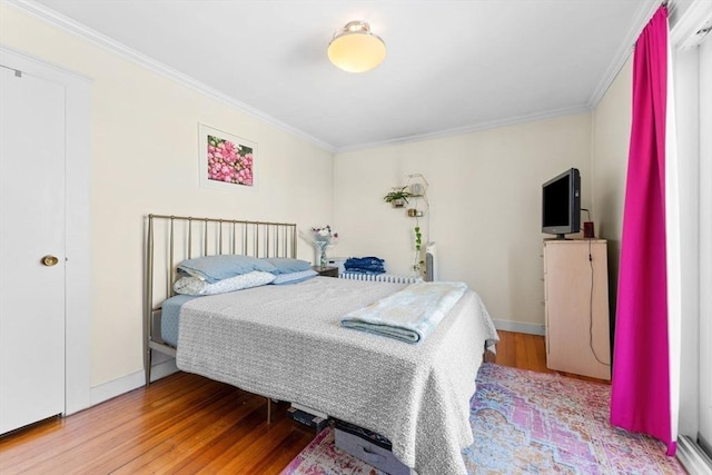92 Winthrop Shore Dr Unit 2, Winthrop, MA 02152 - bedroom featuring ornamental molding, wood finished floors, and baseboards