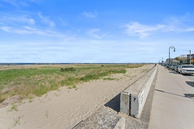 92 Winthrop Shore Dr Unit 2, Winthrop, MA 02152 - view of asphalt road featuring street lighting and sidewalks