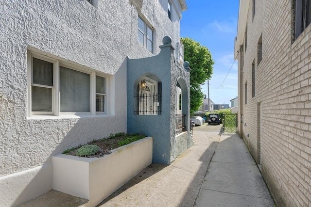 92 Winthrop Shore Dr Unit 2, Winthrop, MA 02152 - view of property exterior with stucco siding