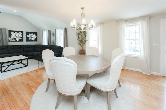 dining room with lofted ceiling, recessed lighting, a notable chandelier, baseboards, and light wood-style floors