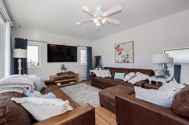 living room featuring light wood-style floors and ceiling fan