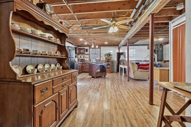 interior space with ceiling fan and light wood-style flooring