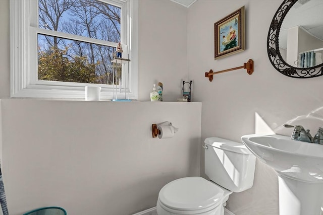 bathroom featuring toilet and a sink