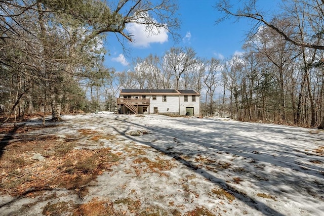 view of property exterior with a deck