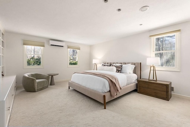 carpeted bedroom featuring an AC wall unit