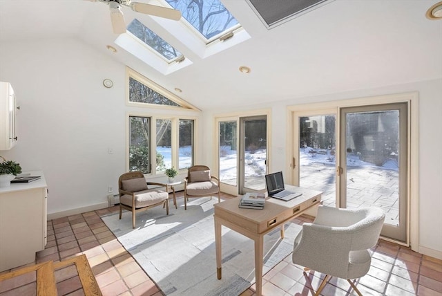 sunroom featuring a baseboard radiator and lofted ceiling with skylight