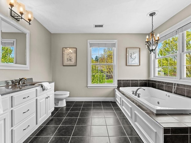 bathroom featuring visible vents, toilet, baseboards, a whirlpool tub, and a notable chandelier