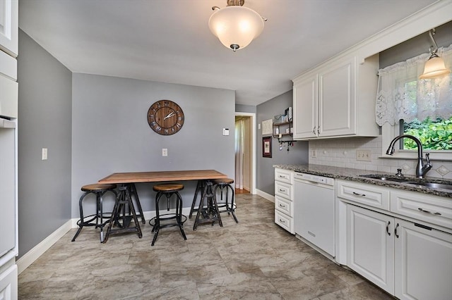 985 Tinkham Rd, Wilbraham, MA 01095 - kitchen with dishwasher, white cabinets, decorative backsplash, and dark stone counters