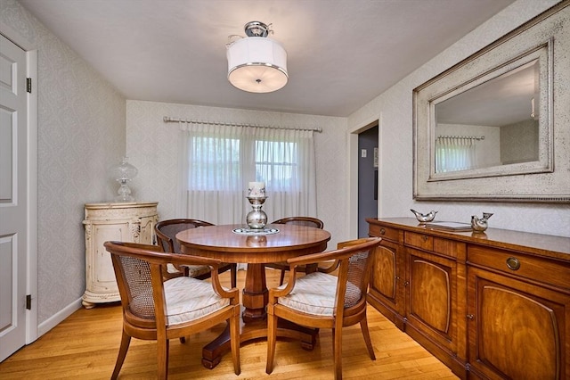 985 Tinkham Rd, Wilbraham, MA 01095 - dining area with light wood-style flooring and wallpapered walls