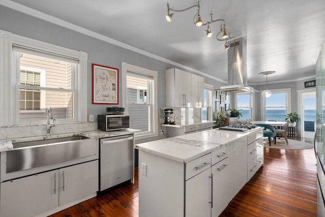 kitchen with pendant lighting, a center island, white cabinetry, island exhaust hood, and stainless steel appliances