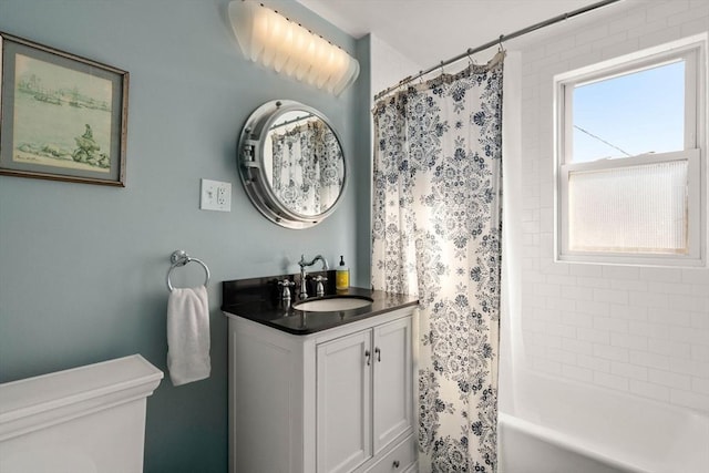 bathroom with shower / tub combo and vanity