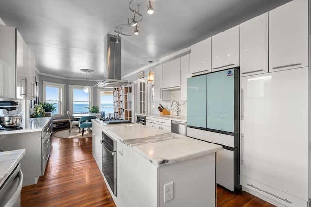 kitchen with a center island, decorative light fixtures, island range hood, white cabinetry, and stainless steel appliances