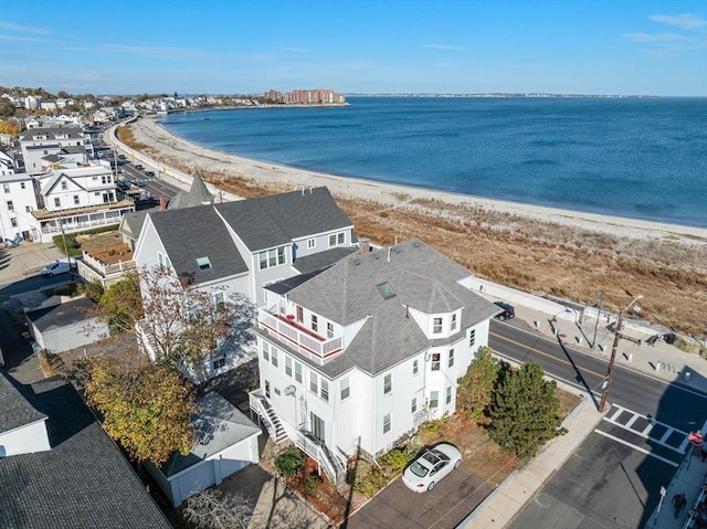 bird's eye view featuring a view of the beach and a water view