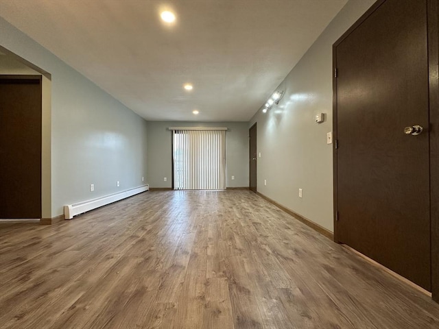 82 S Maple St Unit 44, Westfield, MA 01085 - unfurnished room featuring a baseboard radiator, wood finished floors, and recessed lighting